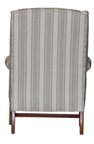 A carmel wingback chair in a striped fabric